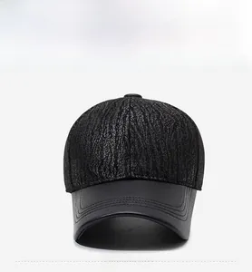 Detailed front view of black PU leather baseball cap showing textured fabric and stitching