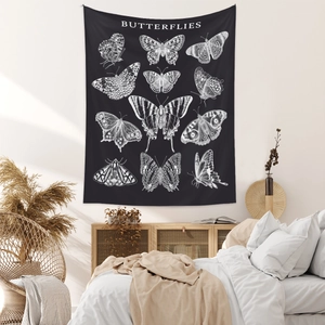 Detail of bohemian black moon phase tapestry with white butterfly and moth illustrations