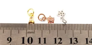 Detailed macro view of 6mm micro-pave star charms in gold, rose gold and silver finishes