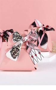 Pink leather wedding favor bags with elegant printed silk scarves and bowknot handles