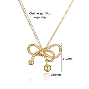 Detailed view of golden bow necklace pendant with 45cm chain length and size specs