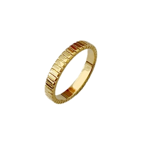 Minimalist gold titanium steel ring with vertical grooved texture for modern daily wear