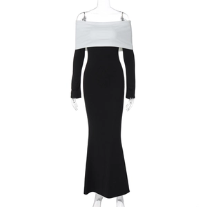 Detail of the off-shoulder black and white contrast slim fit fishtail maxi dress