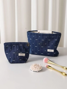 Retro denim bow cosmetic bag set with heart patterns and gold floral zipper detail