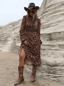 Detail of leopard print maxi dress with brown leather belt and western cowboy style