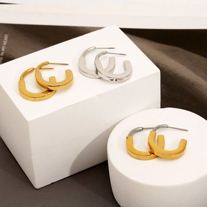 U-shaped stainless steel geometric hoop earrings in gold and silver finishes