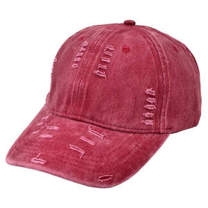 Vintage distressed baseball cap in washed burgundy cotton with trendy ripped edge details