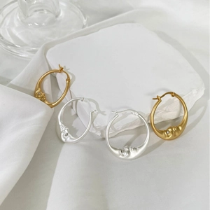 Minimalist crescent moon hoop earrings with zircon accents in gold and silver finishes