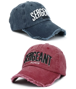 Detail of vintage washed baseball caps featuring 3D Sergeant Pepper embroidery and frayed edges