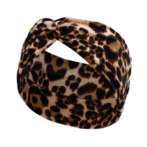 Detailed view of leopard print knotted headband made of soft velvet material
