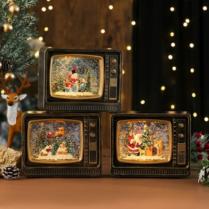 Vintage TV Christmas snow globe lantern with Santa and reindeer scene, warm LED light