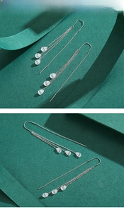 Macro shot of S925 sterling silver long tassel ear threads with zircon drop pendants
