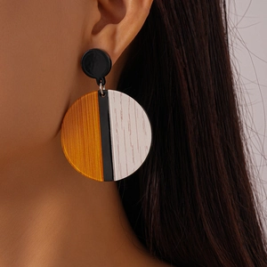 Geometric acrylic round color-block drop earrings with orange and white wood grain textures