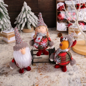 Three-piece set of plush Christmas dolls including Santa Claus, elk, and gnome figurines