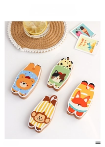 Detailed view of animal wooden magnetic bottle openers featuring bear and cat designs