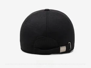 Rear view of black winter baseball cap showing adjustable metal buckle and textured fabric