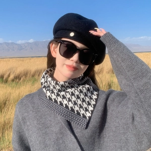 Outdoor winter scarf featuring black and white houndstooth pattern and wave knit design