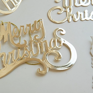 Golden Merry Christmas metal hanging sign with elegant script font and gold string