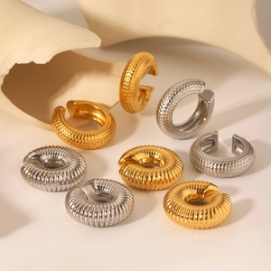 Minimalist C-shaped stainless steel ear cuffs with scale texture in gold and silver