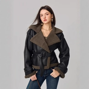 Women's black leather jacket with dark brown faux fur collar and waist belt detail