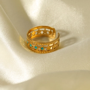 18K gold plated stainless steel open ring with blue enamel stars on silk fabric