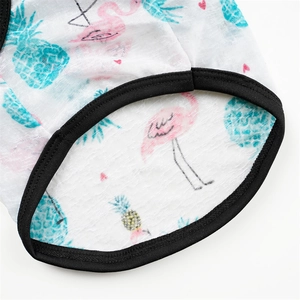 Detail of breathable pet vest fabric with flamingo prints and neat black elastic trim