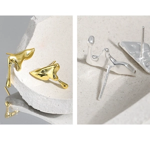 Detailed macro view of S925 sterling silver studs with irregular fluid lava design