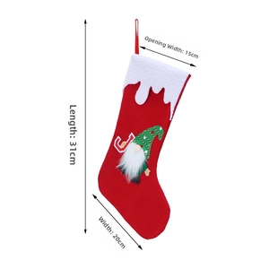 Detail of felt Christmas stocking with gnome motif showing dimensions 31cm long and 20cm wide