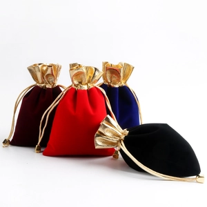 Velvet drawstring jewelry pouches in burgundy, red, blue, and black with gold metallic trim