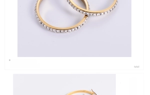Macro detail of golden hoop earrings featuring paved clear crystals and polished finish