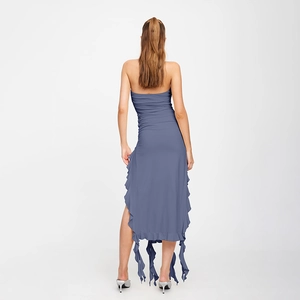Detailed view of the dusty blue strapless dress with ruffles and flowing ribbons