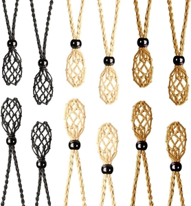 Detail of hand-woven net necklace pouches in black, off-white, and light brown colors