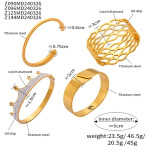 Detail showing titanium steel gold bracelets with dimensions, weights, and Czech diamonds