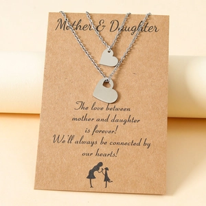 Silver mother and daughter heart necklace set on kraft card with heartfelt English text