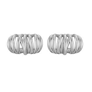 Detailed macro view of silver twisted spiral ear studs with intricate hollow metal design