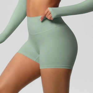Close-up of high-waist fitness shorts in sage green with seamless push-up effect