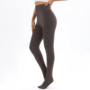 Detail of high-waist thermal leggings in dark brown-grey with wide elastic tummy control band