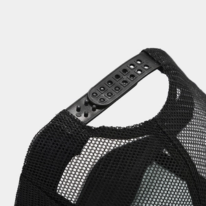 Detail of adjustable black snapback strap and breathable mesh on trucker baseball hat