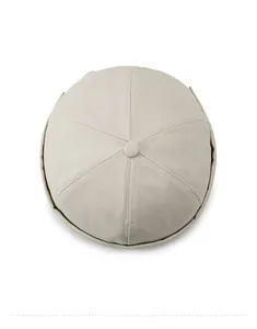 Top view of beige Miki hat showing six-panel cotton fabric and button detail