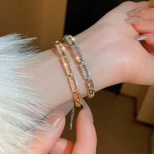 Luxe geometric cuff bracelet with cubic zirconia paving in gold and silver plating