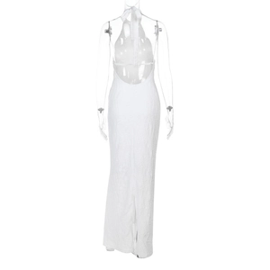 Detail of white backless halter dress featuring unique textured fabric and open back design