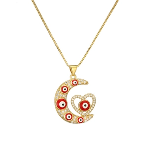Collier doré avec pendentif lune et cœur, perles œil grec rouge et zircons brillants