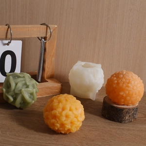 Detailed spherical flower silicone mold for handmade candles with textured relief design
