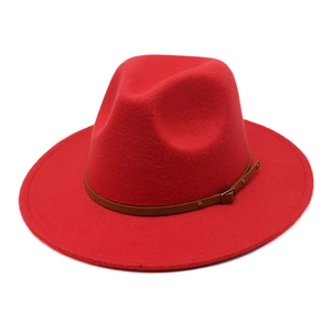 Classic red wide brim fedora hat with brown leather band and gold buckle detail