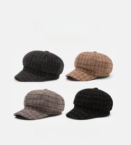 Detailed grid view showing four colors of vintage plaid newsboy caps with soft top texture