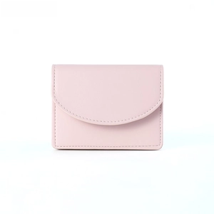 Close-up of minimalist light pink leather wallet featuring fine stitching and curved flap
