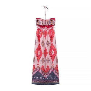 Bohemian floral halter neck maxi dress with pink geometric print and waist cut-out