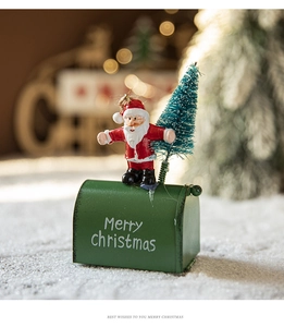 Close-up of red metal mailbox with Santa and green flocked tree in a cozy festive scene