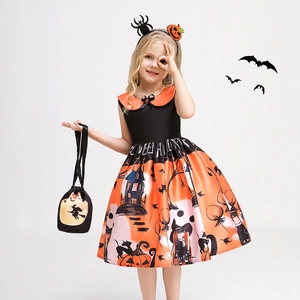 Detail of Halloween pumpkin dress with witch prints, headband and matching gift bag