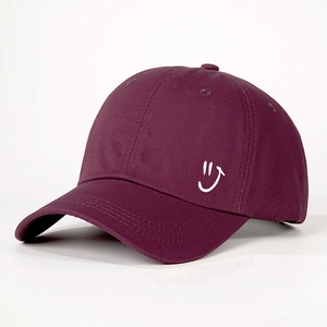 Retro burgundy baseball cap with white smiley face embroidery and adjustable strap